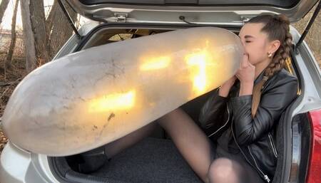 Inflating and bursting a condom and spitting (custom video)