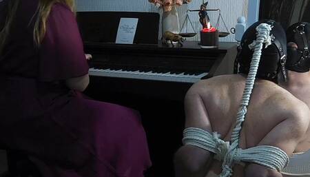 Male slave listens to Her music
