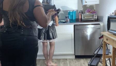 slave dressed as maid unicorn doess dishes while goddess and her minion have fun