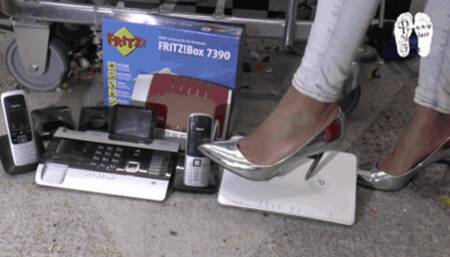 Electronic devices crushed under metal Heels