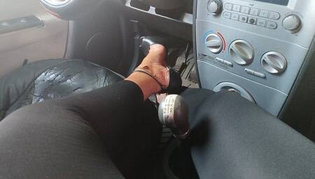 I work the lever of my car with the pronounced arches of my feet and high heels (1)