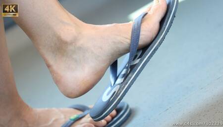 Hot feet with dirty and ruined flip flops, foot and slippers close-up fetish