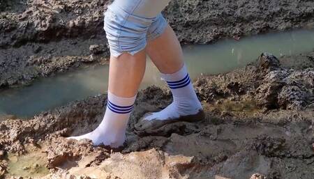 Knee high white socks in mud, white stockings in mud, wet socks, dirty feet, muddy white socks