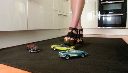 Giantess Raven Lee crushes a 3 classic American convertible toy cars in sexy heels with painted toenails low right view