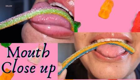 close-up of mouth and tongue while eating candies