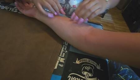 Scratches to the arms (long nails)