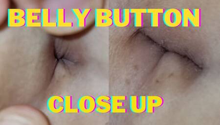close-up playing with my navel ( oil , lipstick and saliva)