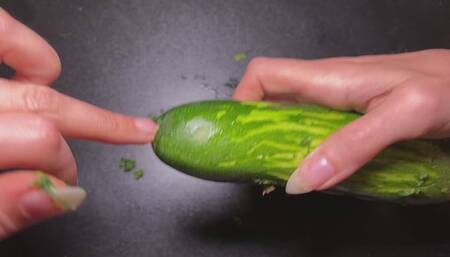 Destroying zucchini with my long sharp natural nails