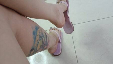 Flip-flops hanging from Tami's pronounced arches (4)