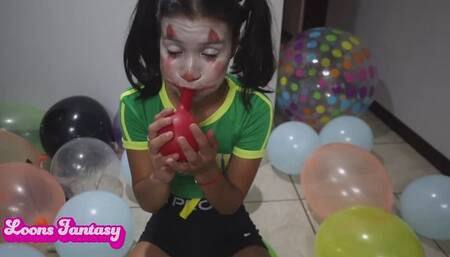 Akina blowing balloons on a space hopper part 2