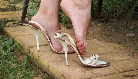 Gianmarco Lorenzi shoeplay on a street, lost straps walking, high heels dangling and posing