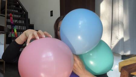 Natural long nails popping balloons