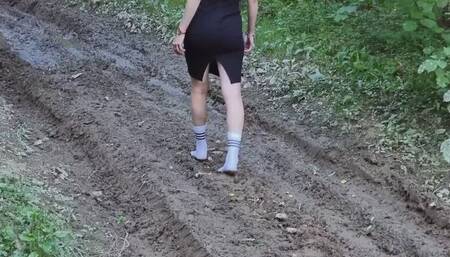 Muddy nylon socks, white socks in a deep mud, wet and muddy white socks, white socks stuck