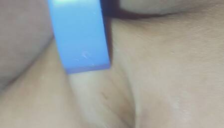 Using a grabber tool toy to pull out my belly button