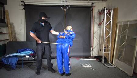 Ms Ungeniert bound, gagged and spanked in a shiny PVC Saunasuit