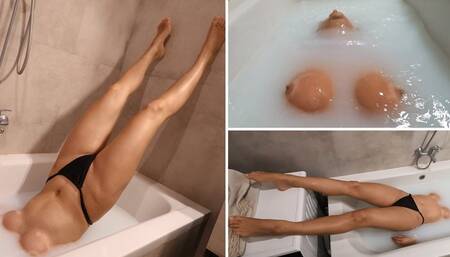 Jade holds her breath in a milky bathtub 4K
