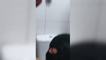 Paloma Veiga and Masked in a Public Bathroom