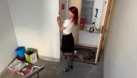 A girl in stockings and shoes plays hard with shoes and nylon stockings, dirties them with dust, tears stockings to shreds and crushes shoes and bends heels