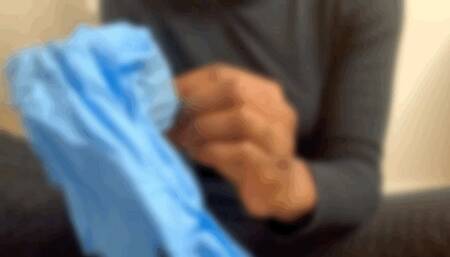 Big Giant hands playing in gloves with lotion