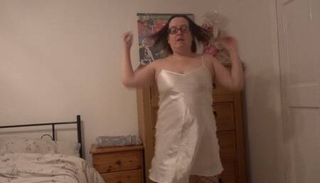 Dancing striptease in silk slip