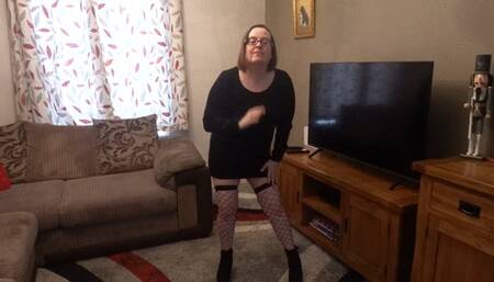 Striptease in Black Woollen minidress fence net stockings ankle boots