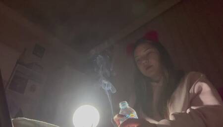 SMOKING YULIANA SENDING SMOKE TOWARDS THE GROUND