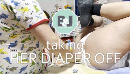 Taking her diaper off
