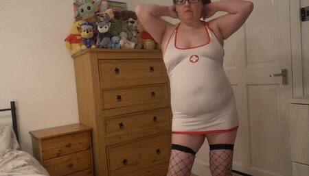 Sexy nurse striptease in skin tight uniform fishnet stockings