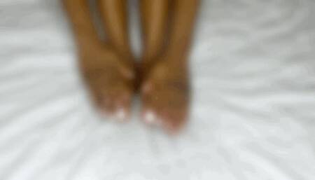 Big foot trying on toe rings