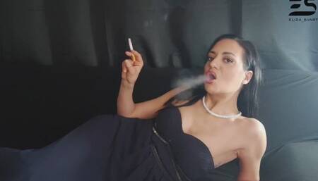 Glamorous smoking in a dark blue Gala dress