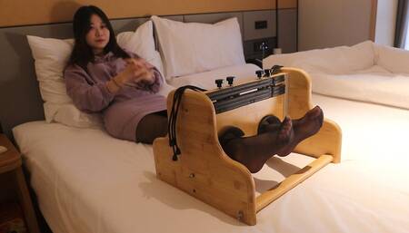 Cute Asian girl's beautiful feet are tickled