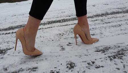 Girl on Louboutin high heels pumps walking on very slippery ice, in louboutin walking on ice