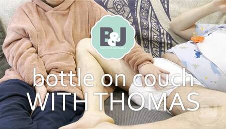 Bottle on couch with Thomas