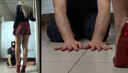 red pumps on hands (detail view)