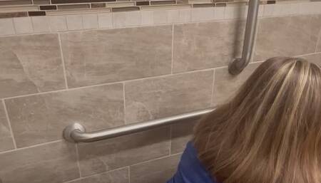 One big log in a public toilet from behind