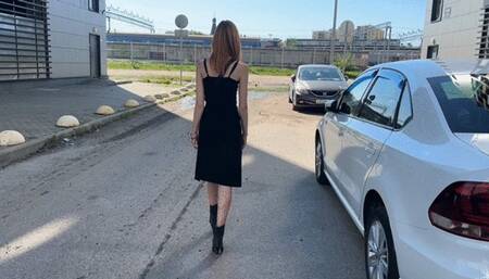 a girl in leather boots walks through puddles with dirty water, which quickly flows into the boots and makes them wet from the inside