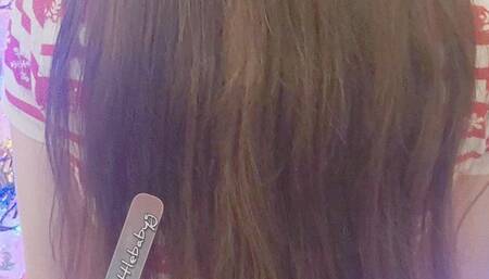 Littleforbig onesie wearing Tinylittlebabyg wiggles and looks at her book