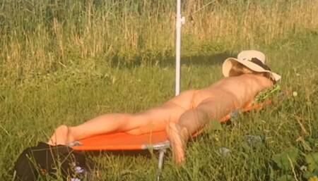 sun bathing , playing with ice on my belly and feet