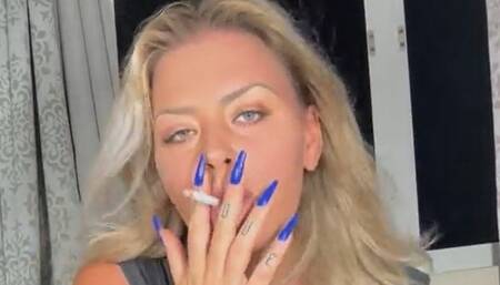 Hot girl smokes with the tits out