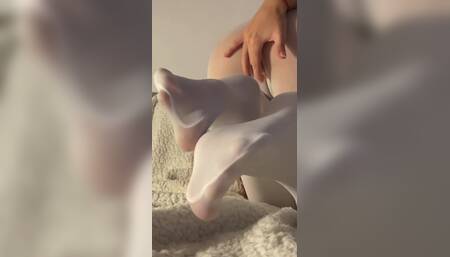Showing my feet in white tights