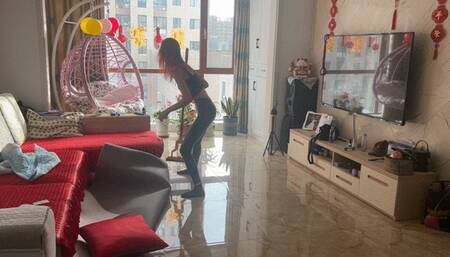 A girl in nylon socks tries to get out, but her socks slip on the floor