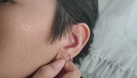 Ear with fetish piercing