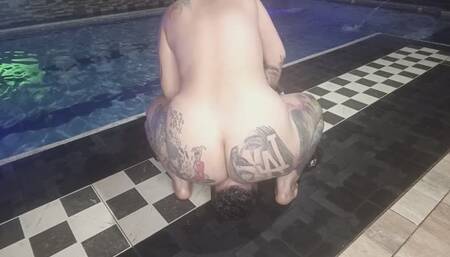 In the pool farting and smashing his face