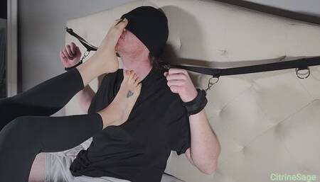 Foot slave bound to the headboard has to worship my feet