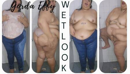 Soaking wet in blue jeans and wet white top