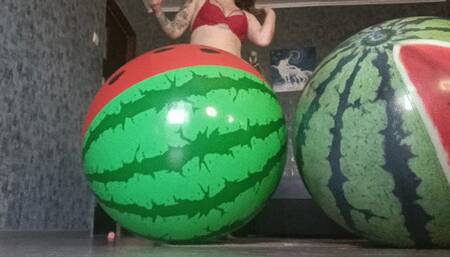 girl riding on 2watermelon beachballs