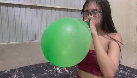 Blow to pop big balloon with Savannah