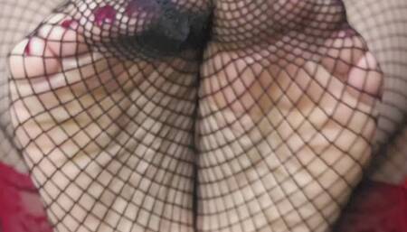 Here’s a descriptive and Sensual Textures: Fishnets, Oil, and Bare Skin