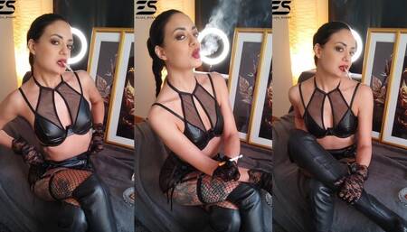 Smoking in leather and fishnet stockings
