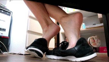 Bare foot play with men black sneakers